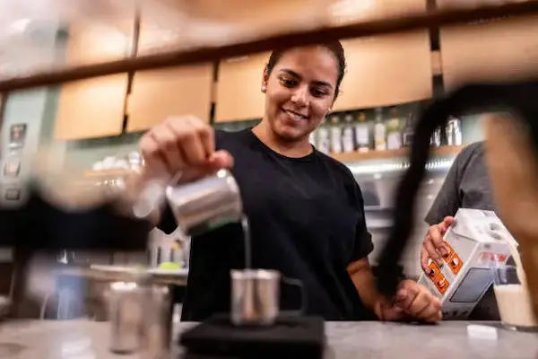 Barista preparing coffee in cafe